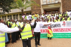 happy team at finish line county hq chanting peace